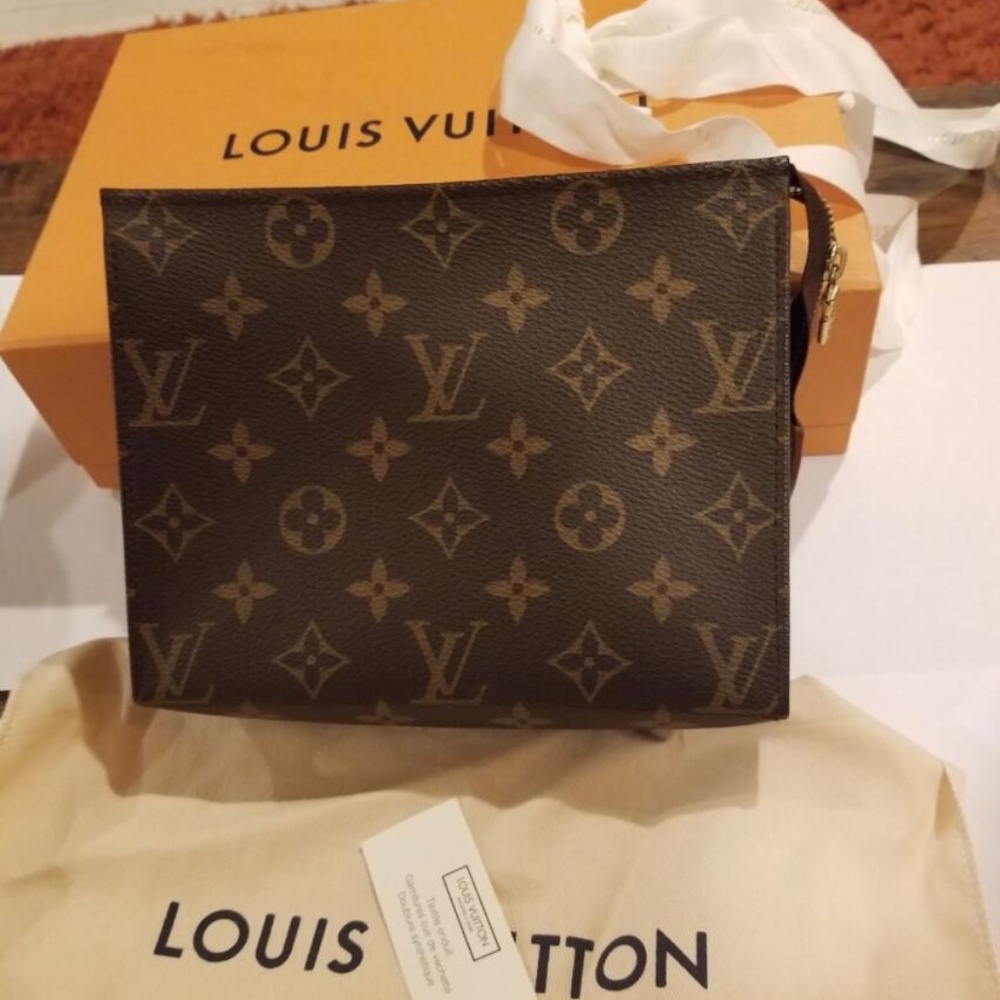 Authentic Louis Vuitton Toiletry Pouch !! Worn only twice!!